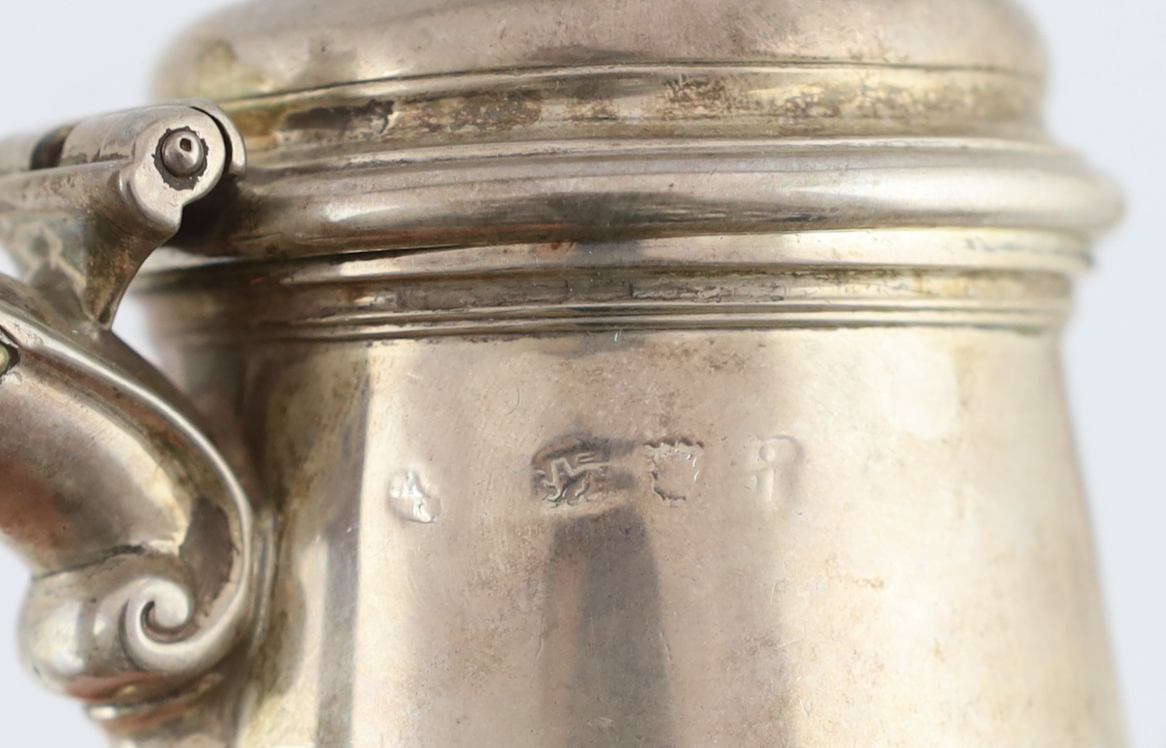 A George II silver coffee pot and hinged cover with turned finial, William Williams I